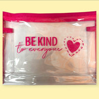 Clear Be Kind to Everyone® zippered pouch against a yellow background.