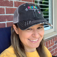 Jackie wearing a Be Kind To Everyone embroidered hat (original design).