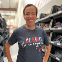Julie in our Nurse style Be Kind to Everyone® shirt (she is wearing a small).