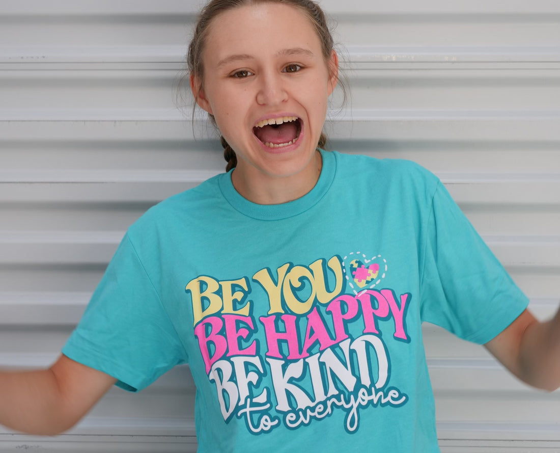 Jordyn, goofing around in her Be You, Be Happy, Be Kind to Everyone® short-sleeve shirt.