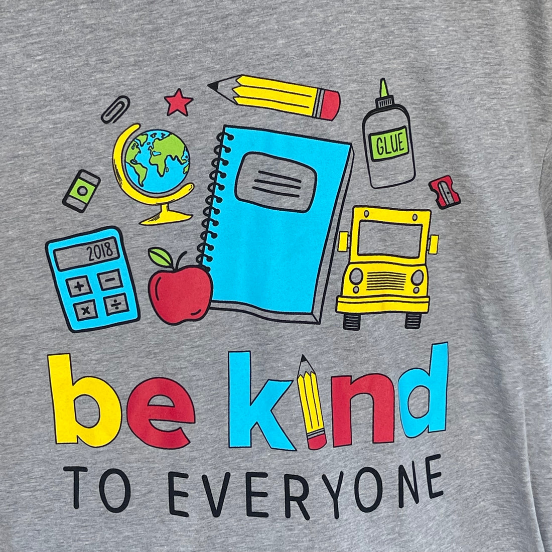 Close-up image of our School Be Kind to Everyone short-sleeved t-shirt.