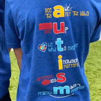 The back of our Autism Awareness/Acceptance tee features some of our favorite shirt shop sayings: See the able... not the label; Never give up; Be kind to everyone; Inclusion matters; Different... not less, Practice makes progress.