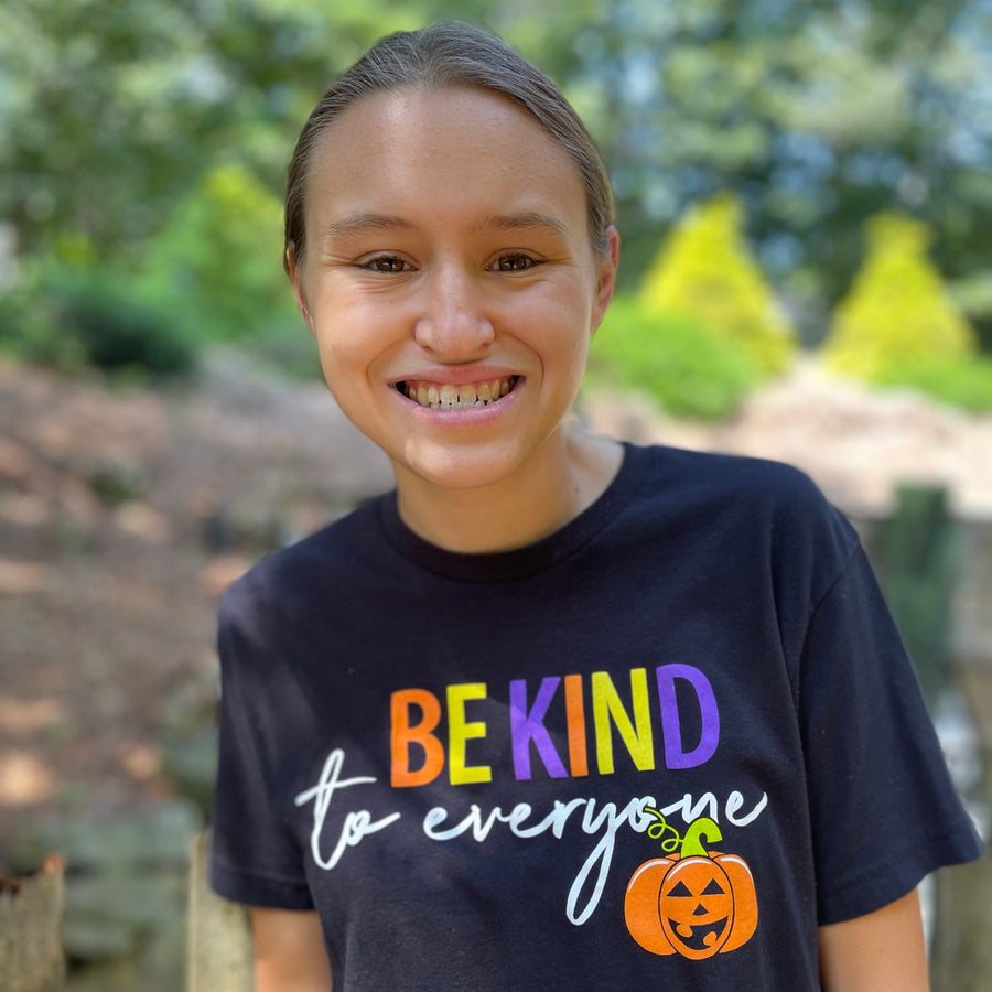 Jordyn, modeling a small in our Halloween Be Kind to Everyone® short-sleeved t-shirt.