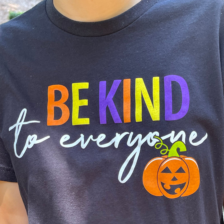 Zoomed in image of our Halloween Be Kind to Everyone® short-sleeved t-shirt.