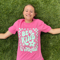 Jordyn in our Adult Pink Retro Checkerboard Be Kind to Everyone® Tee