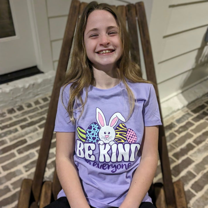 Our egg-cellent model Kate is wearing a medium in our Easter Be Kind to Everyone® short-sleeved tee.