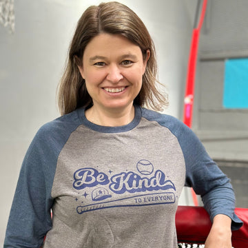 Jackie, modeling our Baseball Be Kind to Everyone® Raglan tee with 3/4 length sleeves.  She is wearing a medium in this photo.