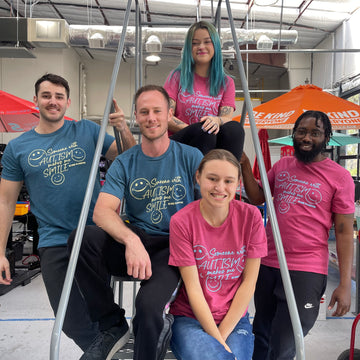 The Shirt Shop Crew is modeling the shirts in our Autism Awareness T-shirt Surprise Packs. Sarah is wearing a raspberry medium; Dylan is wearing a teal XL; Ryan is wearing a teal large; Kei is wearing a raspberry medium; and Jordyn is wearing a raspberry small.