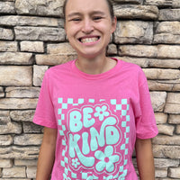Jordyn wearing a small in our Adult Pink Retro Checkerboard Be Kind to Everyone® Tee.