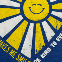 Our Someone with Autism Makes Me Smile Be Kind to Everyone® tee features a puzzle piece in one of the sunbeams.