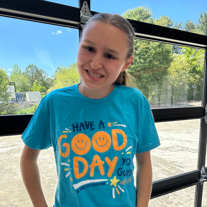 Jordyn, modeling a small in our adult Have a Good Day You Guys Be Kind to Everyone® short-sleeved tee.