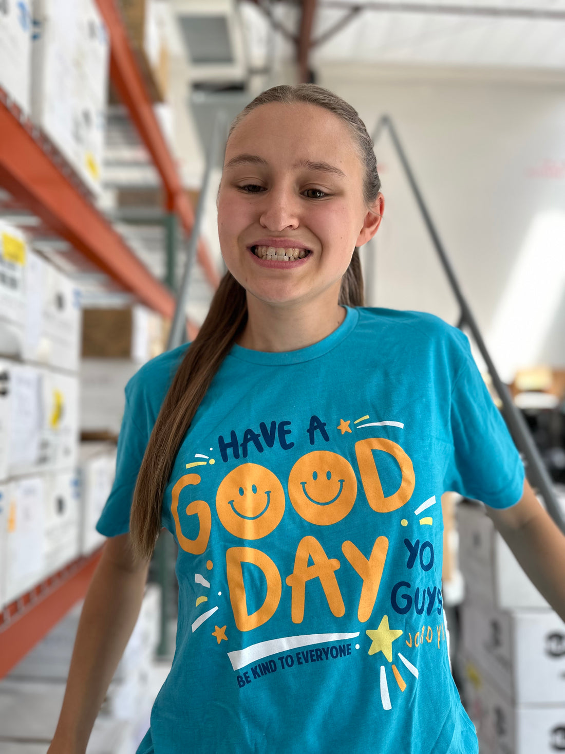 Our Have a Good Day You Guys Be Kind to Everyone® short-sleeved tee comes in a pretty bondi blue.