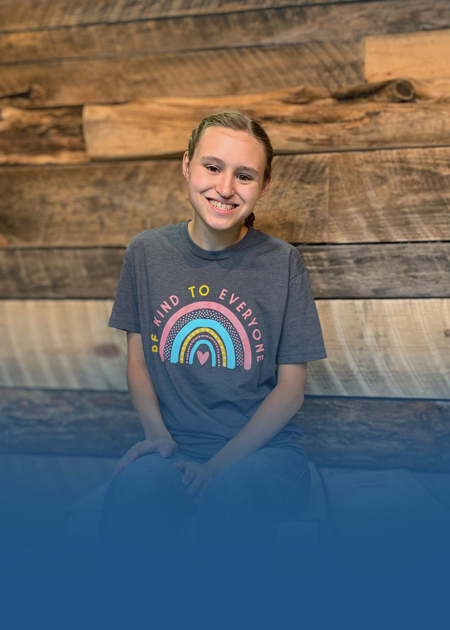 Jordyn, wearing our Rainbow Be Kind to Everyone® t-shirt, one of our best selling designs.