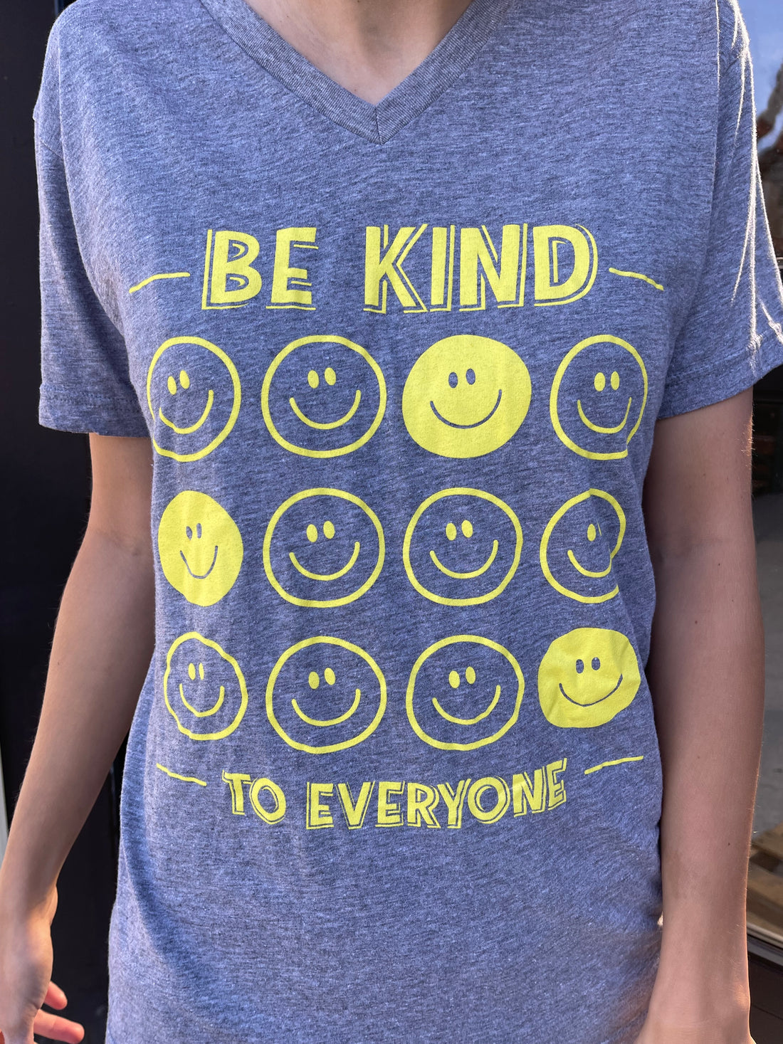 Zoomed in image of our All Smiles Be Kind to Everyone® short-sleeved v-neck.