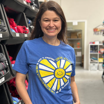 Our new Someone With Autism Makes Me Smile Be Kind to Everyone® short-sleeve tee.  Jackie is wearing a medium in this photo.
