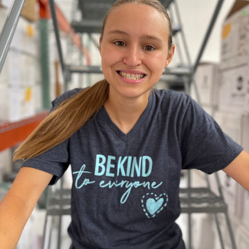 Jordyn, wearing a small in our Jordyn Original Be Kind to Everyone® V-neck t-shirt.