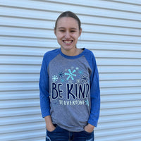 Jordyn wearing a small in our Winter Be Kind to Everyone® Ragland Tee with 3/4 length sleeves