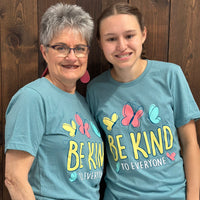Grandma and Jordyn modeling our Butterfly Be Kind to Everyone® Tee.  Grandma is wearing a medium and Jordyn is wearing a small in this photo.