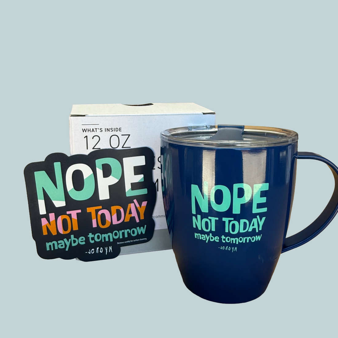 Our Nope Not Today Maybe Tomorrow coffee mug and magnet, against a light blue background.