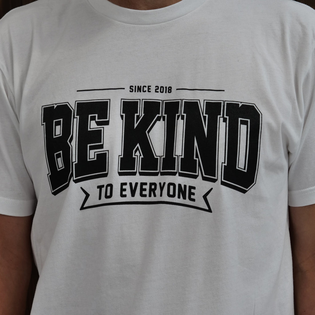Zoomed in image of our new "Ben" Be Kind to Everyone t-shirt in white.