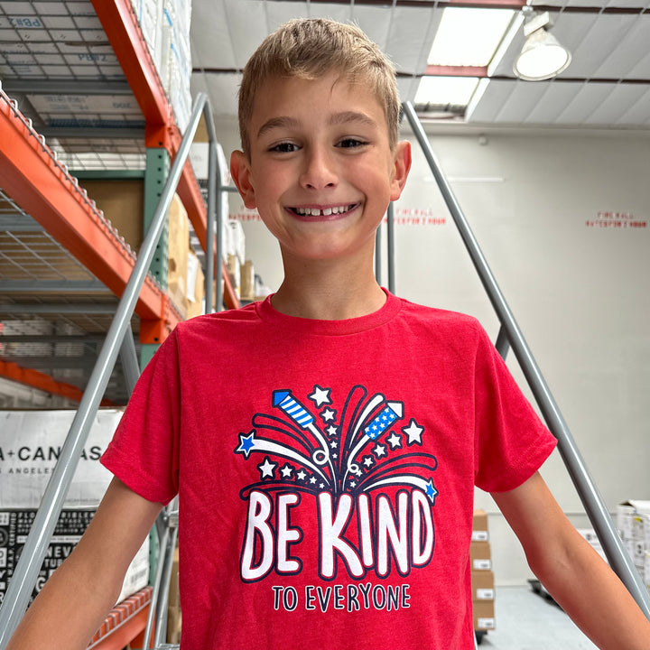 Hudson modeling our youth 4th of July Be Kind to Everyone® tee. 