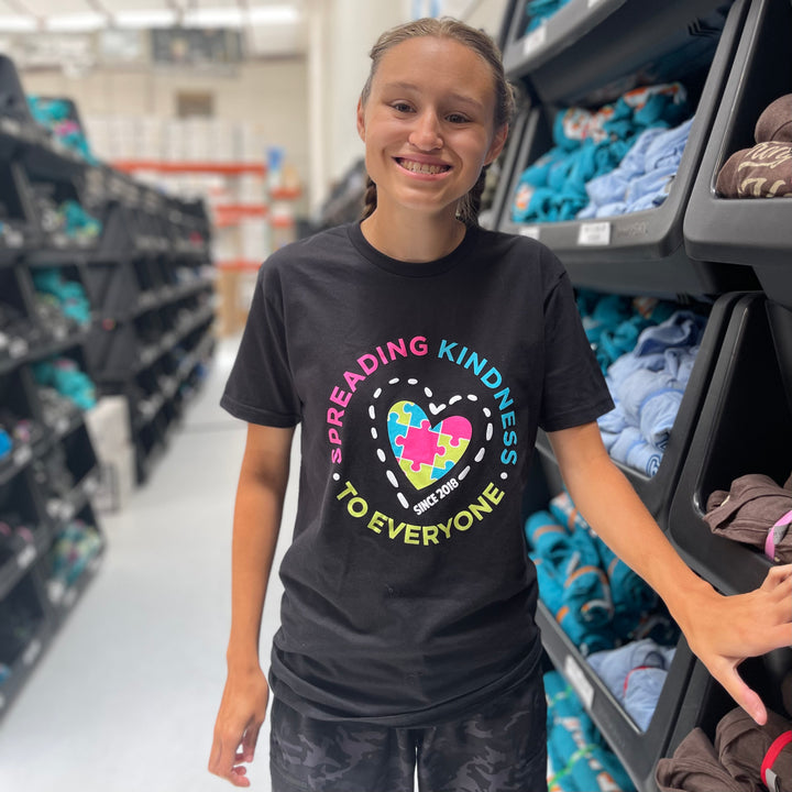 Jordyn, modeling a small in our 5 Year Anniversary Be Kind to Everyone® short-sleeved t-shirt.