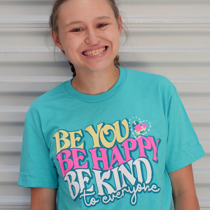 Jordyn, wearing a small Be You, Be Happy, Be Kind to Everyone® short-sleeve shirt.