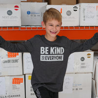 Hudson, having fun at the shirt shop while wearing a youth long-sleeved Hudson Be Kind to Everyone® t-shirt (that's named after him).