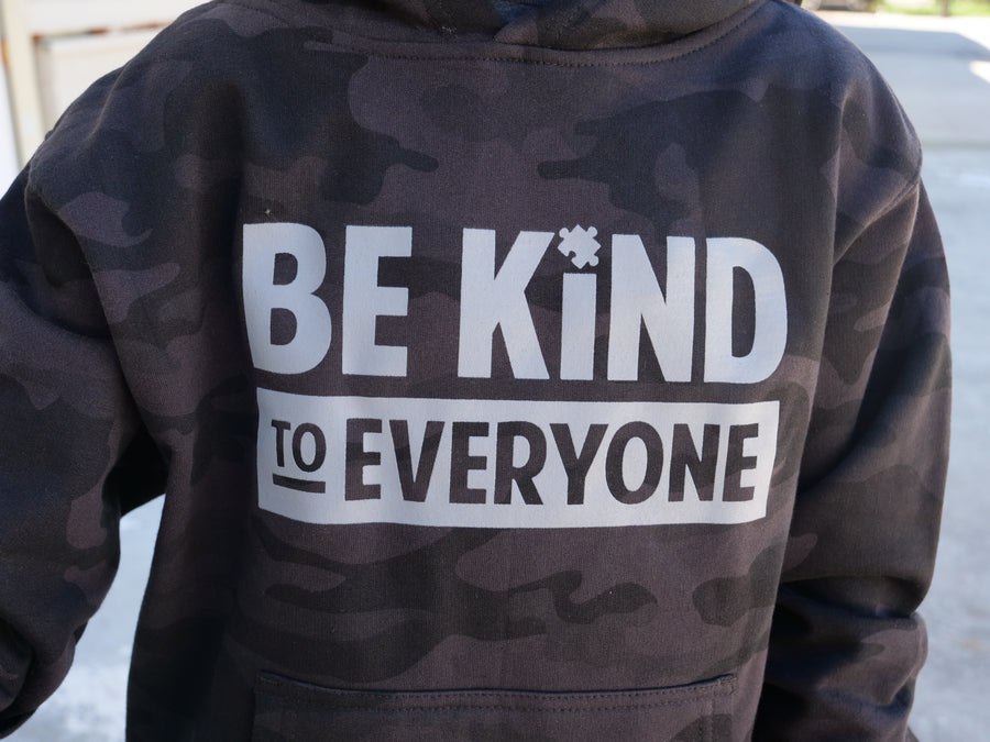Close up image of our youth Hudson Be Kind to Everyone® hoodie in camo.