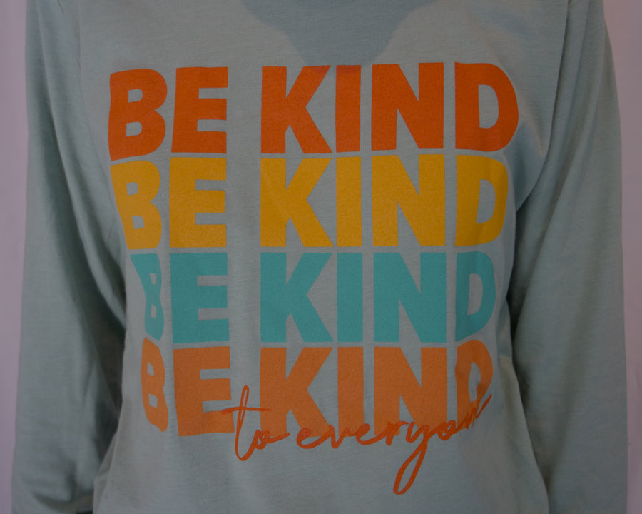Close up image of our Repeating Kindness Be Kind to Everyone® long-sleeved t-shirt.