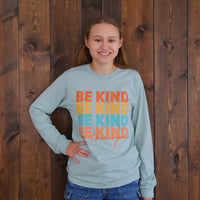 Jordyn modeling our Repeating Kindness Be Kind to Everyone® long-sleeved t-shirt.