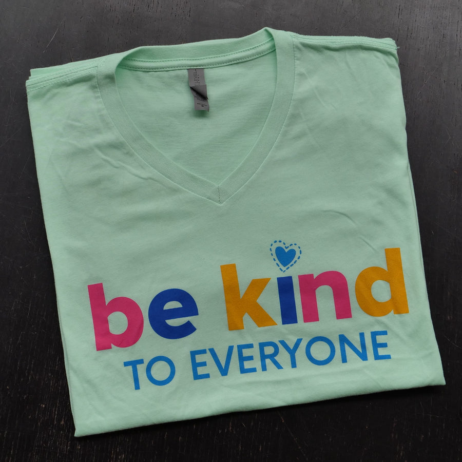 Close up of our mint Be Kind to Everyone® v-neck t-shirt.