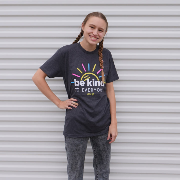 Jordyn, modeling our new Sunshine Be Kind to Everyone® short-sleeved shirt.