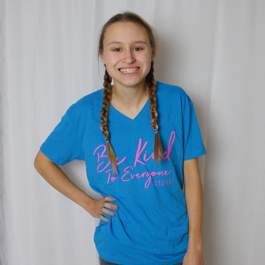 Jordyn modeling our new turquoise Signature Be Kind to Everyone® t-shirt.