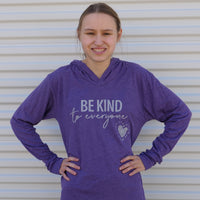 Jordyn in our purple lightweight Original Jordyn Be Kind to Everyone® hoodie for adults.  She is wearing a small in this photo.