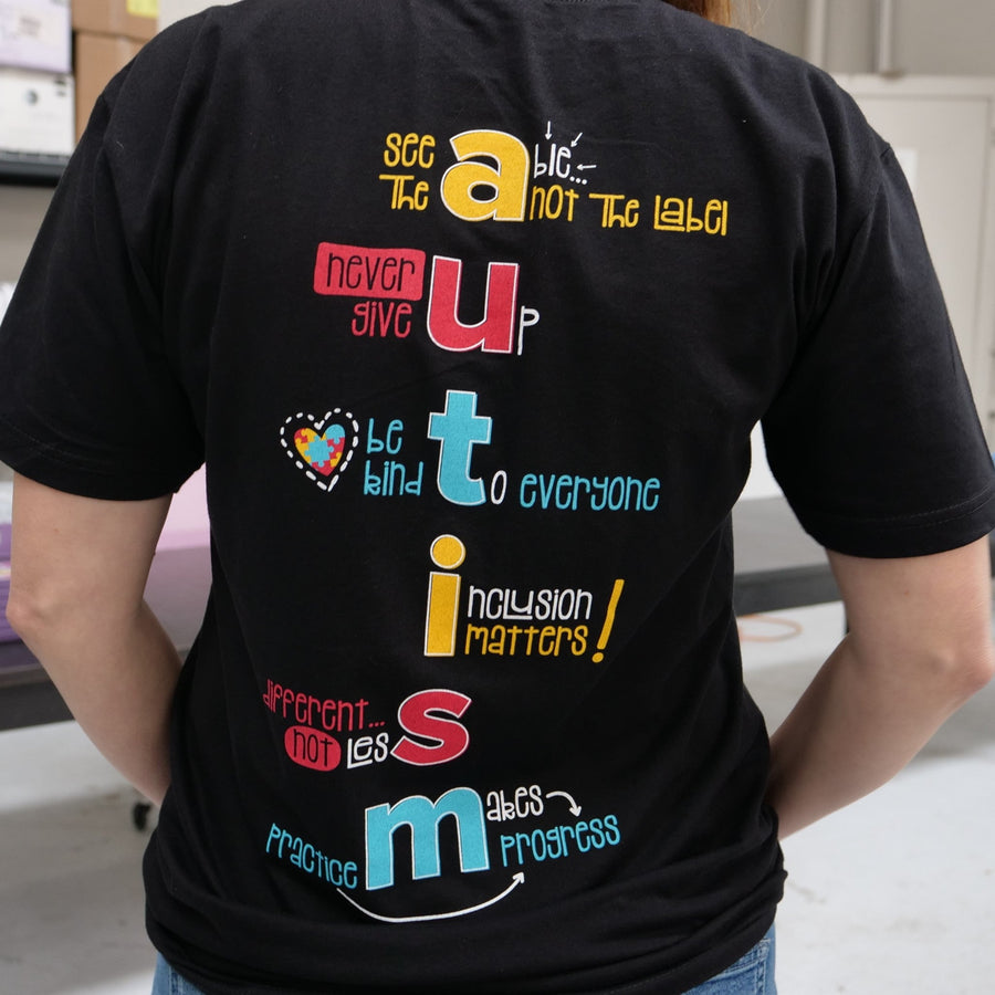Close up of the back of our Autism Awareness/Acceptance Be Kind to Everyone® short-sleeved t-shirt.