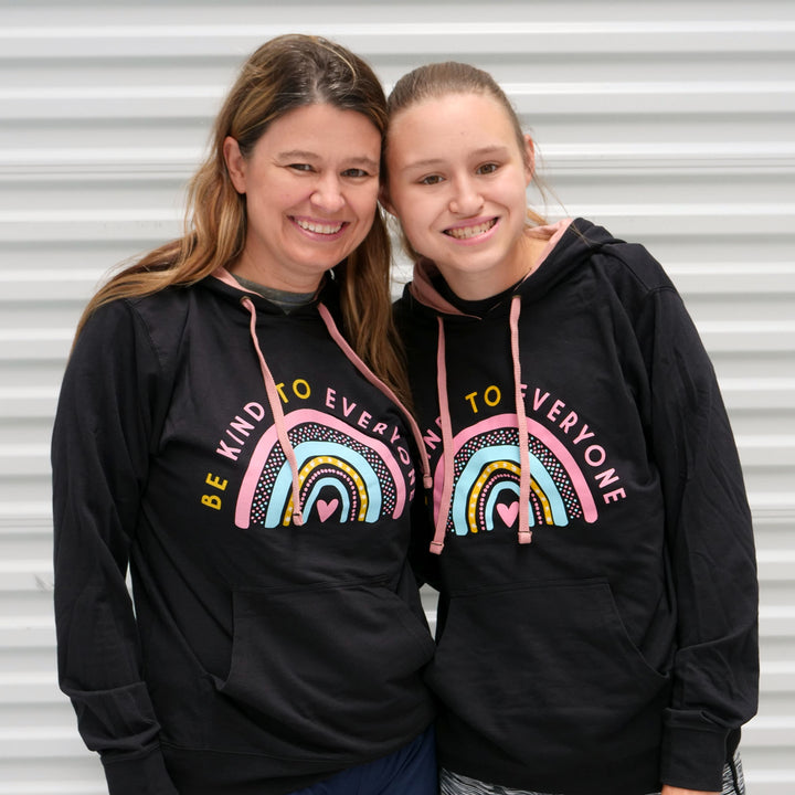 Our Rainbow Be Kind to Everyone® adult hoodies.  Jackie and Jordyn are both wearing smalls in this photo.