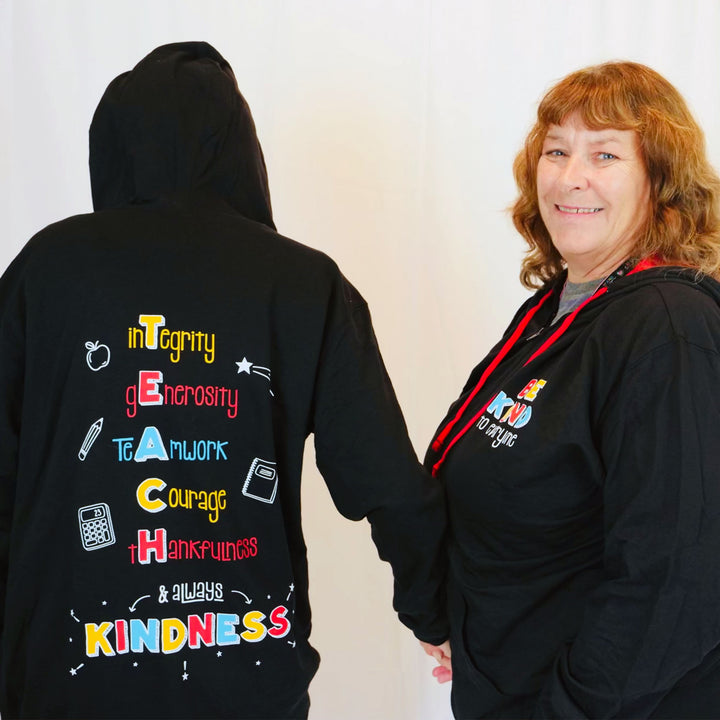 Front and back of our T.E.A.C.H. Kindness Be Kind to Everyone® zip-up hoodies.