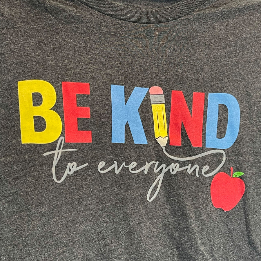 Close up image of our "Teacher" Be Kind to Everyone® short-sleeve shirt.