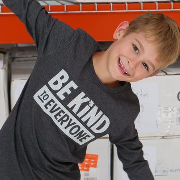 Hudson, in a long-sleeved grey Hudson Be Kind to Everyone® t-shirt.