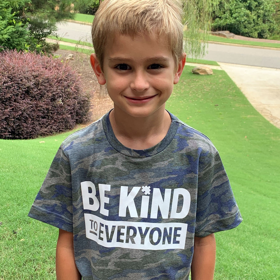 Hudson modeling our Hudson Be Kind to Everyone® youth short-sleeved tee.