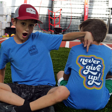Front and back of our Never Give Up Be Kind to Everyone® short-sleeved youth t-shirt.
