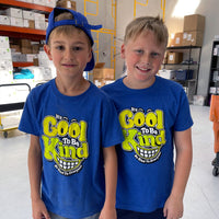 Hudson and friend wearing our It's Cool to Be Kind to Everyone® youth shirts that feature two-tone lettering.