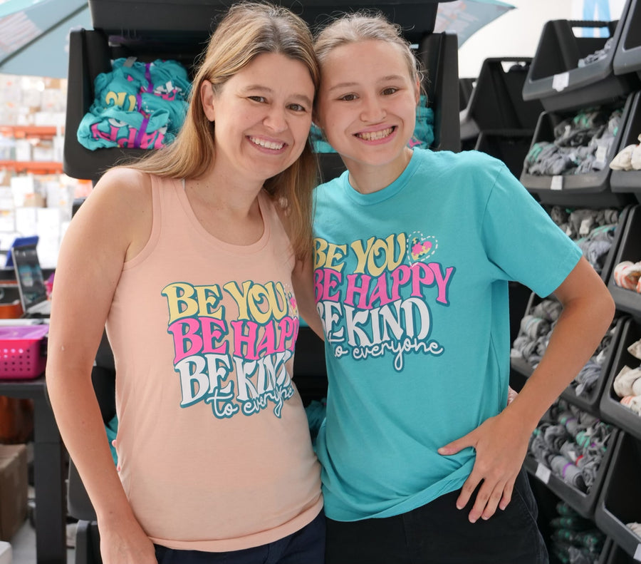 Jackie and Jordyn modeling our Be You, Be Happy, Be Kind to Everyone® tank top and short-sleeved t-shirt.
