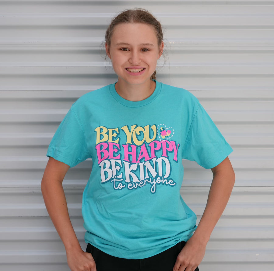 Jordyn, wearing a small Be You, Be Happy, Be Kind to Everyone® short-sleeve shirt.