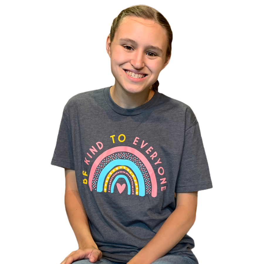 Jordyn, wearing a small "Rainbow" Be Kind to Everyone® shirt (with white background).